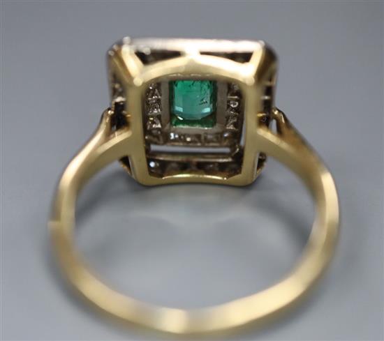 A modern 18ct gold, emerald and diamond chip cluster tablet ring, size O, gross 4.9 grams,